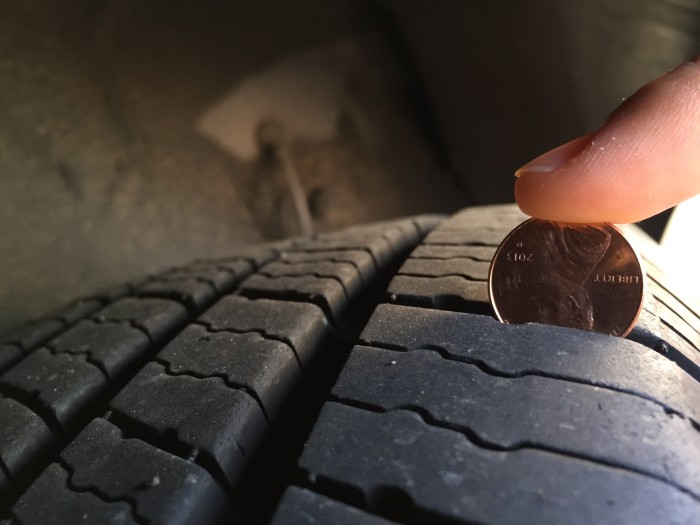 New Tires. Have full tread and you can see that part of a penny is hidden in the grooves