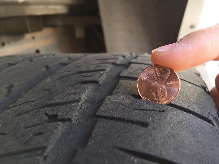 Balding tires. Very worn tires that have little to no tread